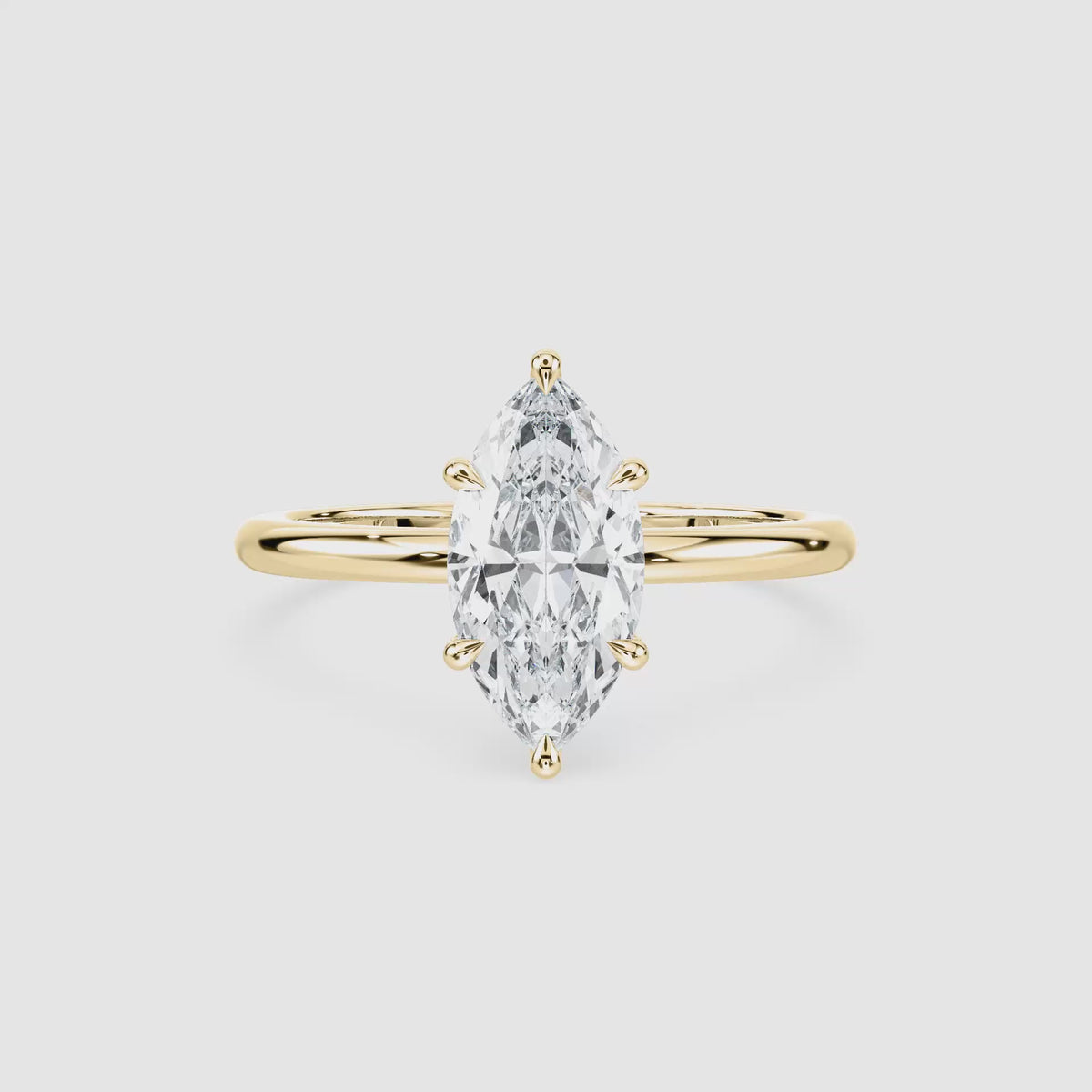 Video laden: Clara Solitaire Verlobungsring – Marquiseschliff – Gelbgold – Video
