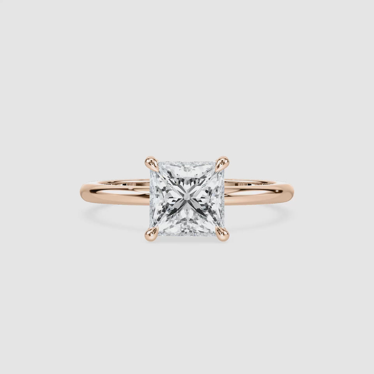 Video laden: Clara Solitaire Verlobungsring – Prinzessschliff – Roségold – Video