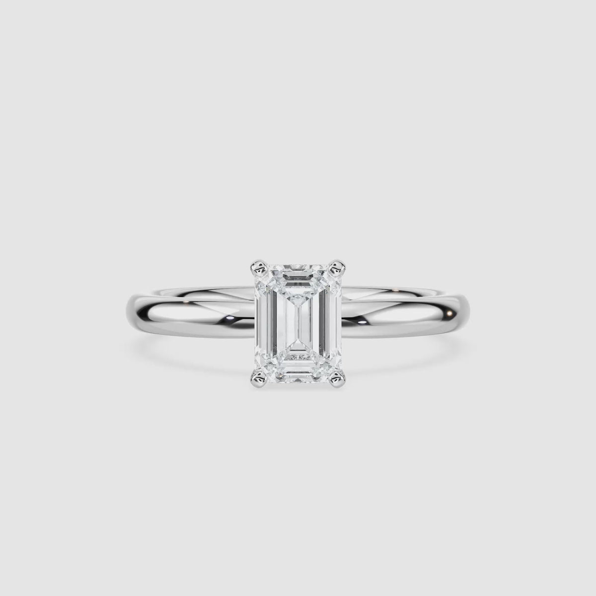 Video laden: Emilia Solitaire Verlobungsring – Smaragdschliff – Weißgold – Video