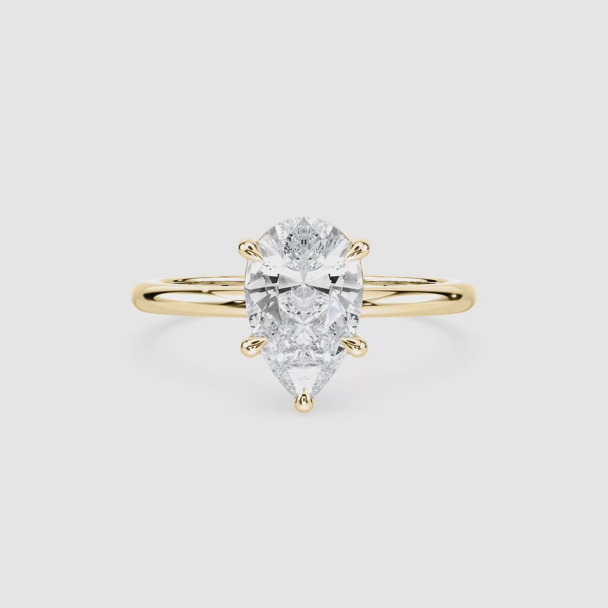 Video laden: Clara Solitaire Verlobungsring – Tropfenschliff – Gelbgold – Video